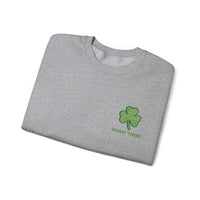 Embroidered green shamrock above bold “Irish True” text in matching green, perfect for St. Patrick’s Day or everyday Irish pride. This embroidered design stands out on a cozy folded grey sweater, celebrating Irish heritage.