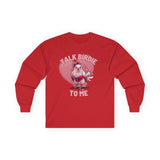 Women's Valentine's Day shirt featuring a humorous and flirty design. The red long-sleeve t-shirt showcases a cartoon-style bird dressed in red lace lingerie with a playful expression, complete with a red bow on its head. The background includes a large pink heart with floating smaller hearts, adding to the romantic theme. Light pink text above and below the bird reads "TALK BIRDIE TO ME," making this a fun Valentine's shirt perfect for bird lovers and those with a cheeky sense of humor.