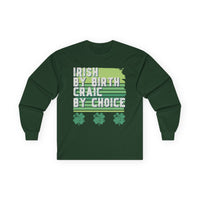 Forest green long-sleeve t-shirt with bold white text reading 'Irish By Birth Craic By Choice' over stripes, celebrating Irish pride and St. Patrick’s Day. Perfect for festive apparel, parades, and parties. Embrace the spirit of craic and Irish heritage!