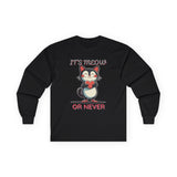 Black long-sleeve Valentine's shirt featuring an adorable cat-themed design. The front showcases a cute black and white cartoon cat with rosy cheeks, holding a red heart and smiling sweetly. Above and below the cat, playful text reads "IT'S MEOW OR NEVER" in a fun, romantic font. This cat lovers' shirt is perfect for Valentine's Day, offering a charming and lighthearted way to celebrate love and affection with a feline twist.