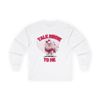 Women's Valentine's Day shirt featuring a humorous and flirty design. The white long-sleeve t-shirt showcases a cartoon-style bird dressed in red lace lingerie with a playful expression, complete with a red bow on its head. The background includes a large pink heart with floating smaller hearts, adding to the romantic theme. Bold pink text above and below the bird reads "TALK BIRDIE TO ME," making this a fun Valentine's shirt perfect for bird lovers and those with a cheeky sense of humor.